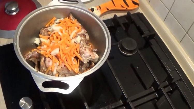 To cook roast rabbit, add vegetables