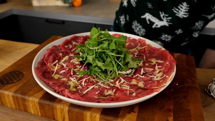 To prepare beef carpaccio, prepare greens