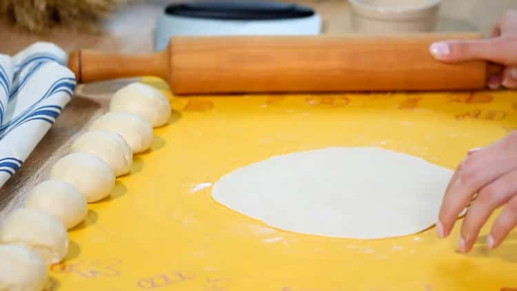 Roll out the dough to make chicken quesadillas