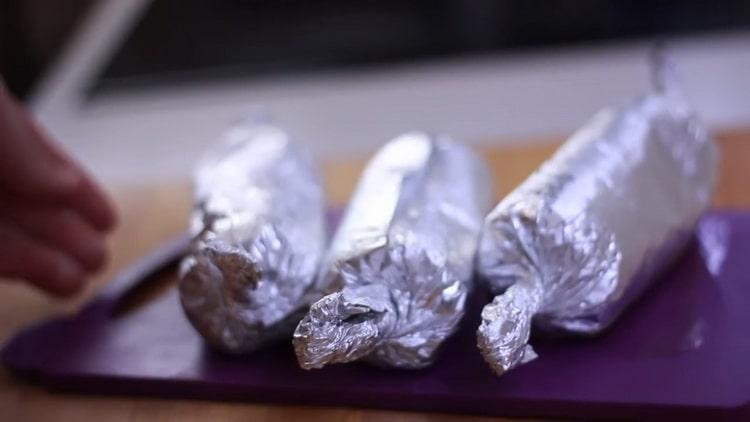 To cook chicken sausages at home, preheat the oven