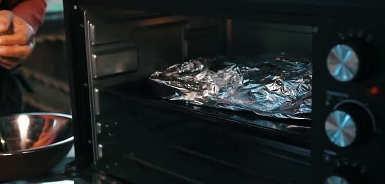 To cook the whole rabbit in the oven. turn on the oven