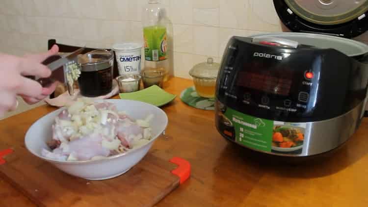 To cook a rabbit in a slow cooker in a sour cream sauce, add garlic