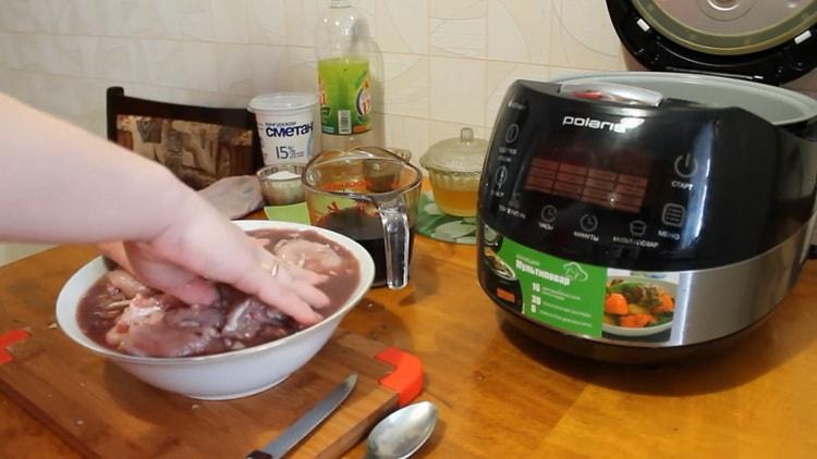 To cook a rabbit in a slow cooker in a sour cream sauce, prepare the marinade