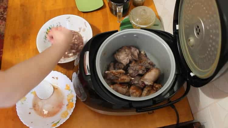 To prepare a rabbit in a slow cooker in a sour cream sauce, prepare the ingredients