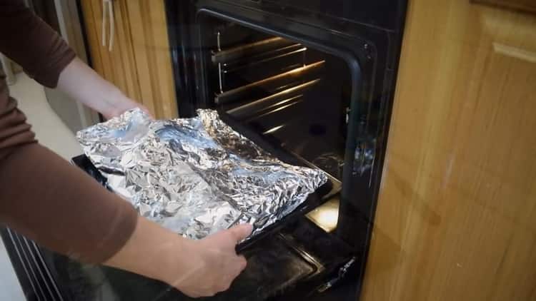 To bake a rabbit in foil, preheat the oven
