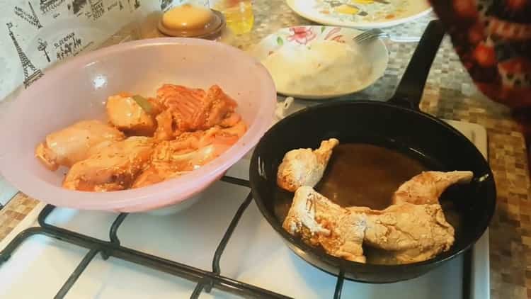 To cook a stewed rabbit with vegetables, heat the pan