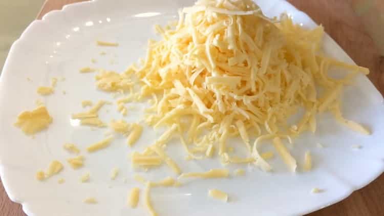 To cook chicken breast with potatoes in the oven, grate cheese