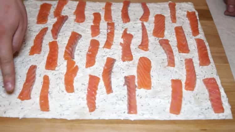 To make pita bread with red fish, cut the fish