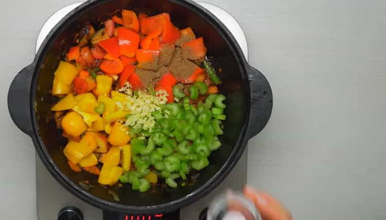 To cook the beef lagman, fry all vegetables