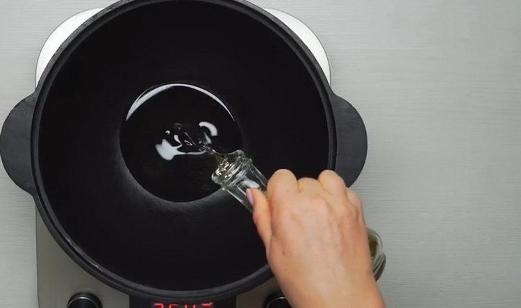 To cook beef lagman, heat the pan