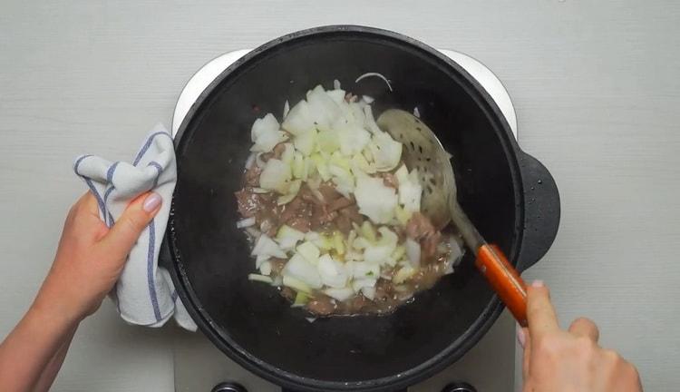 To cook beef lagman, chop onion