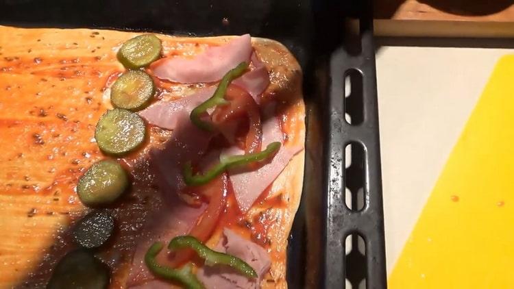 To make the pizza toppings, chop the bell pepper