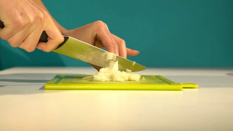 To cook halibut in the oven, chop onions