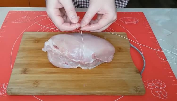 To cook pastrami from chicken breast, roll the meat with a thread