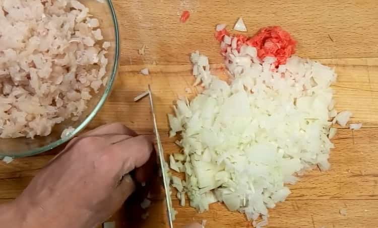 To make pike dumplings, chop the onion