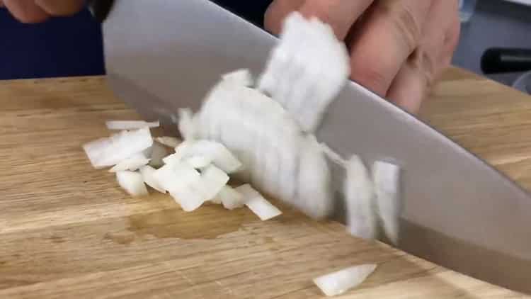 To cook a beef liver cake with a simple recipe, chop the onion