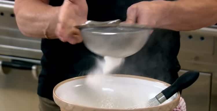 Sift flour to make Madeleine cookies