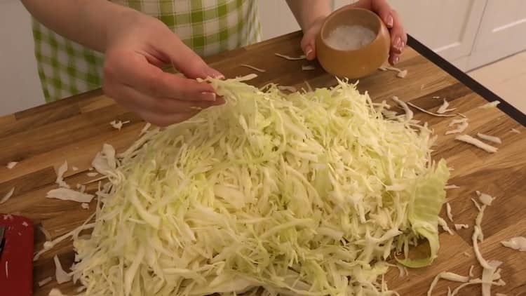 To make a pie with cabbage and egg in the oven, cut all the ingredients