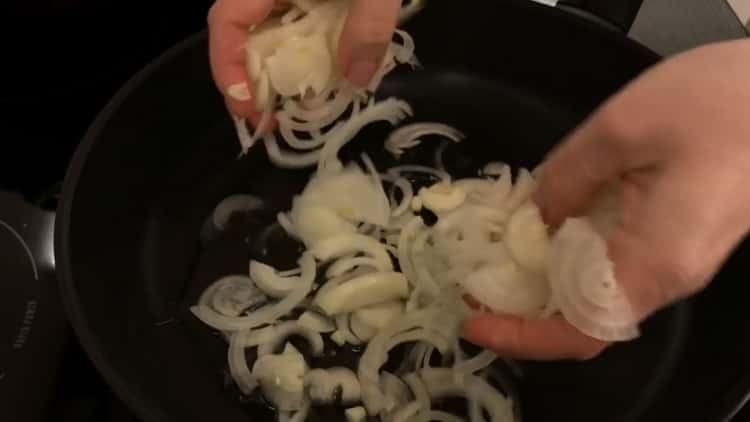 To make a pie with cabbage and egg in the oven, chop the onion