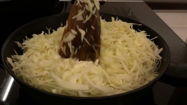 To make a pie with cabbage and egg in the oven, fry the ingredients
