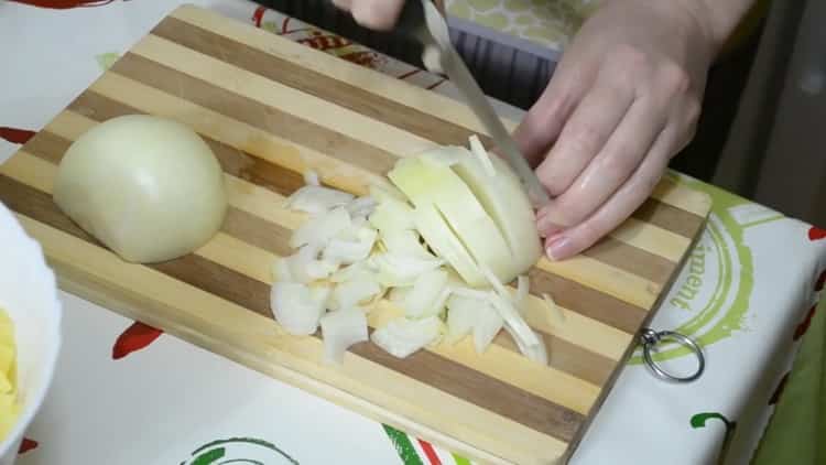 To make a pie with fish and potatoes, chop the onion