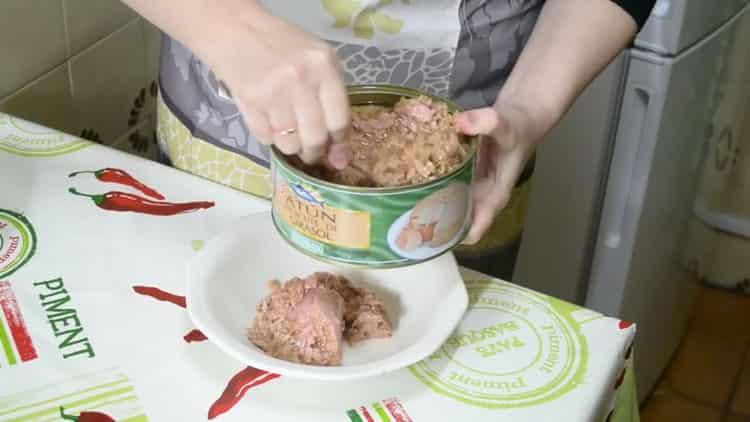 To prepare a pie with fish and potatoes, prepare the ingredients for the filling