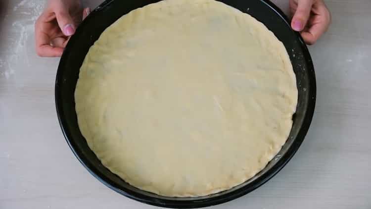 To make pizza without yeast, place the dough on a mold