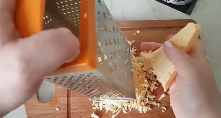 Grate cheese to make pizza without dough