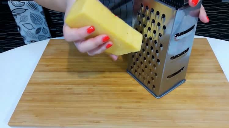To make pizza at home, grate cheese