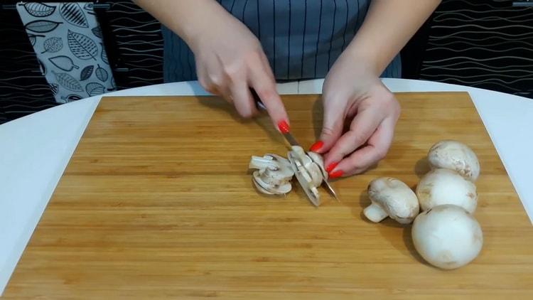 To make pizza at home, chop the mushrooms.