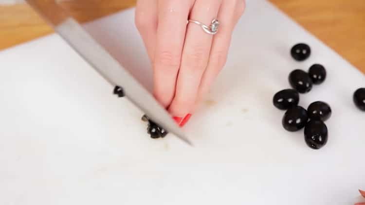 To cook pizza in the microwave, cut olives