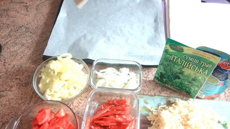To prepare pizza from puff pastry in the oven, prepare a baking sheet