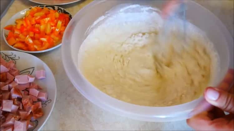 Sift flour into a batter.