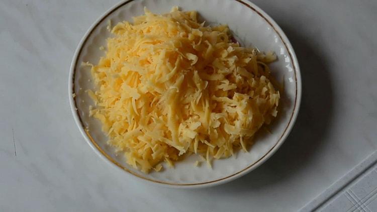 To make pizza on puff pastry, grate cheese