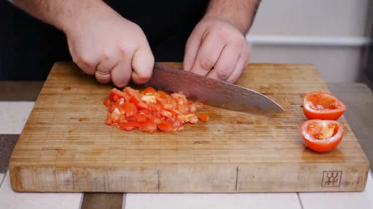 To make a pizza pie, chop the tomatoes