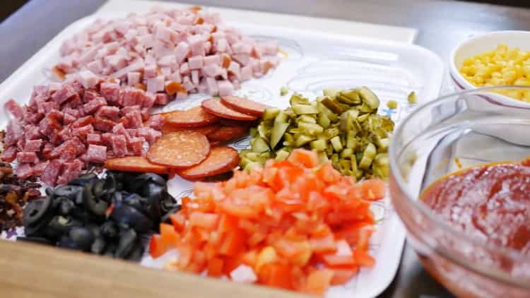 To make a pizza pie, divide the filling