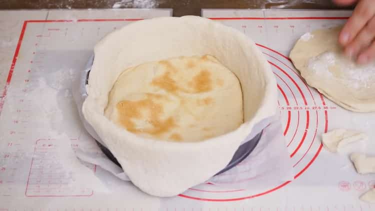 To make a pizza pie, prepare the dough