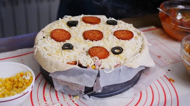 To make a pizza pie, lay out the top layer