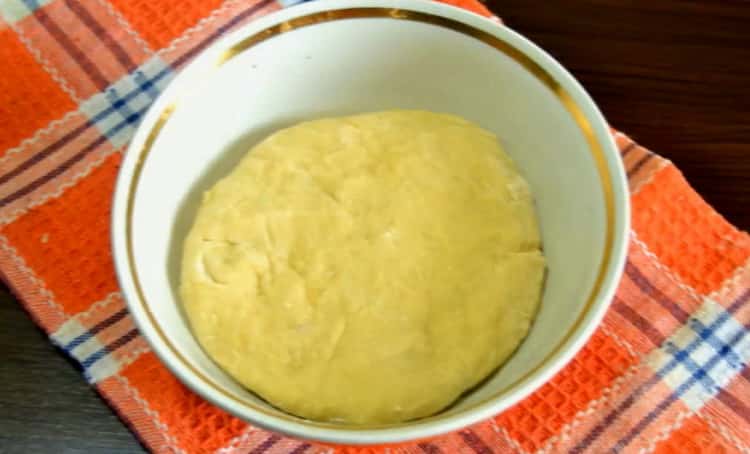 To make pizza with bacon, knead the dough.