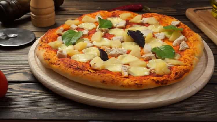 pizza with chicken and pineapple is ready