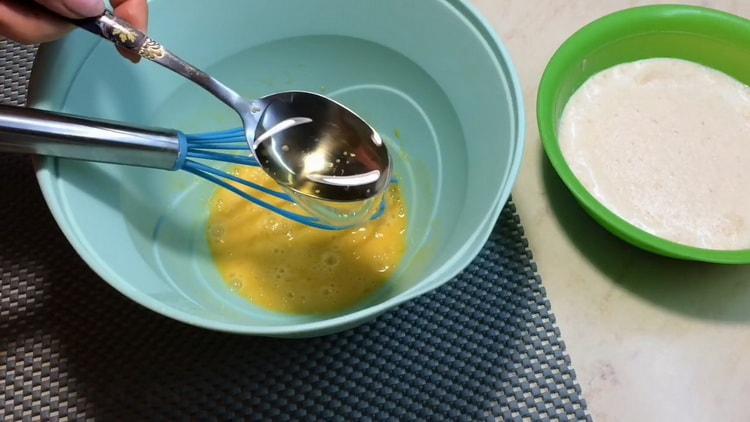 Beat eggs to make Caesar pizza