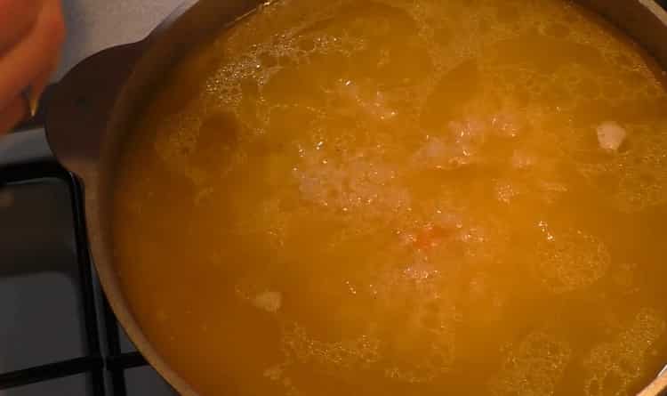 To cook pilaf with chicken in a cauldron, add rice