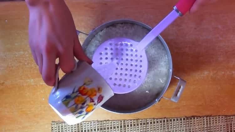 To cook pilaf with chicken in a pan, add water