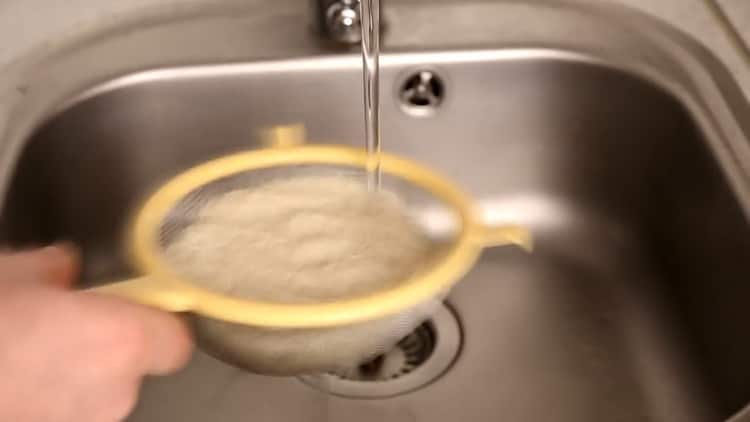 To cook rice with chicken in the oven, rinse the rice