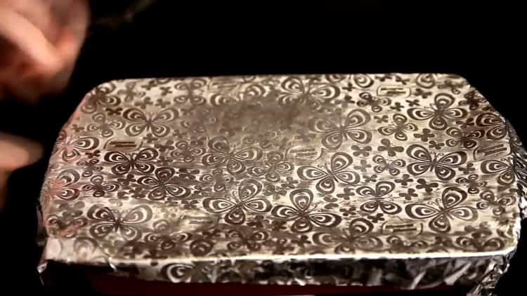 To cook rice with chicken in the oven, cover the dish with foil