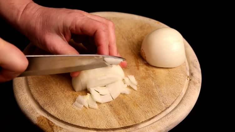 To cook rice with chicken in the oven, chop the vegetables
