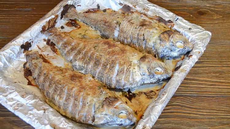 To cook fish on sour cream in the oven, preheat the oven