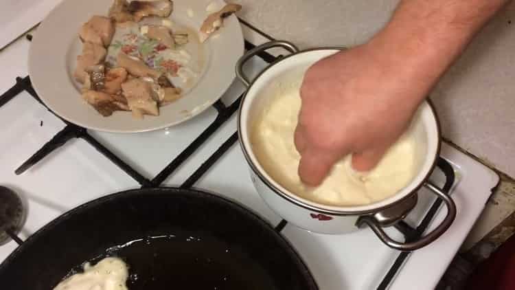 To cook fish in the dough, fry the fish in a pan