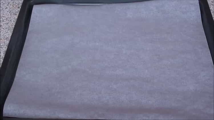 To prepare fish under a fur coat in the oven, prepare parchment