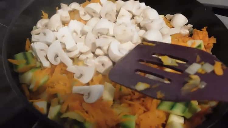 To cook fish with rice in the oven, cut mushrooms